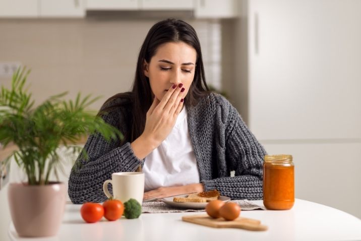 woman feeling nauseous