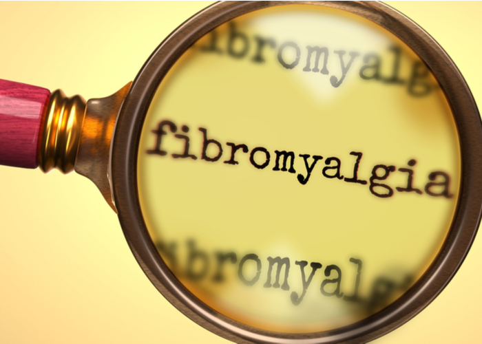 magnifying glass focusing on the word fibromyalgia